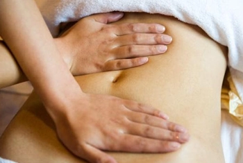 Postpartum womb Massage